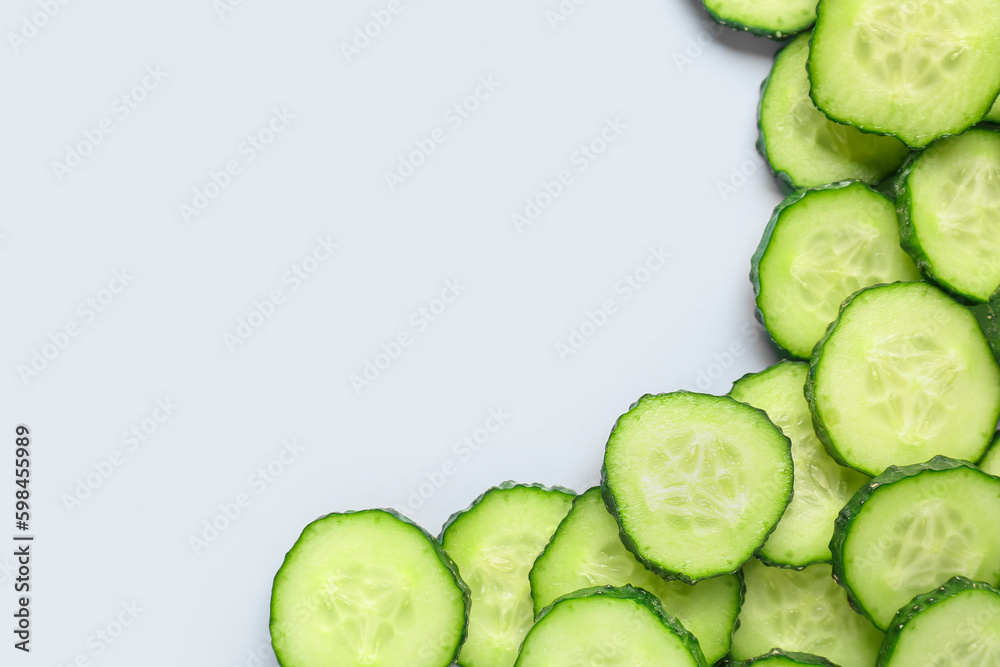 Slices of cucumber on blue background