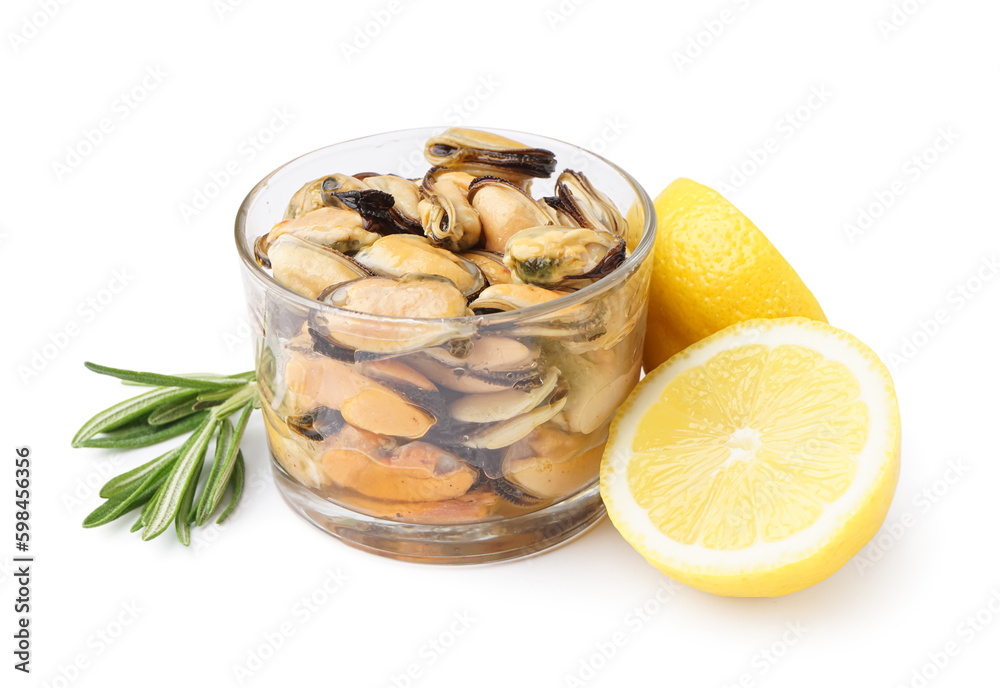 Marinated mussels in glass with lemon halves on white background