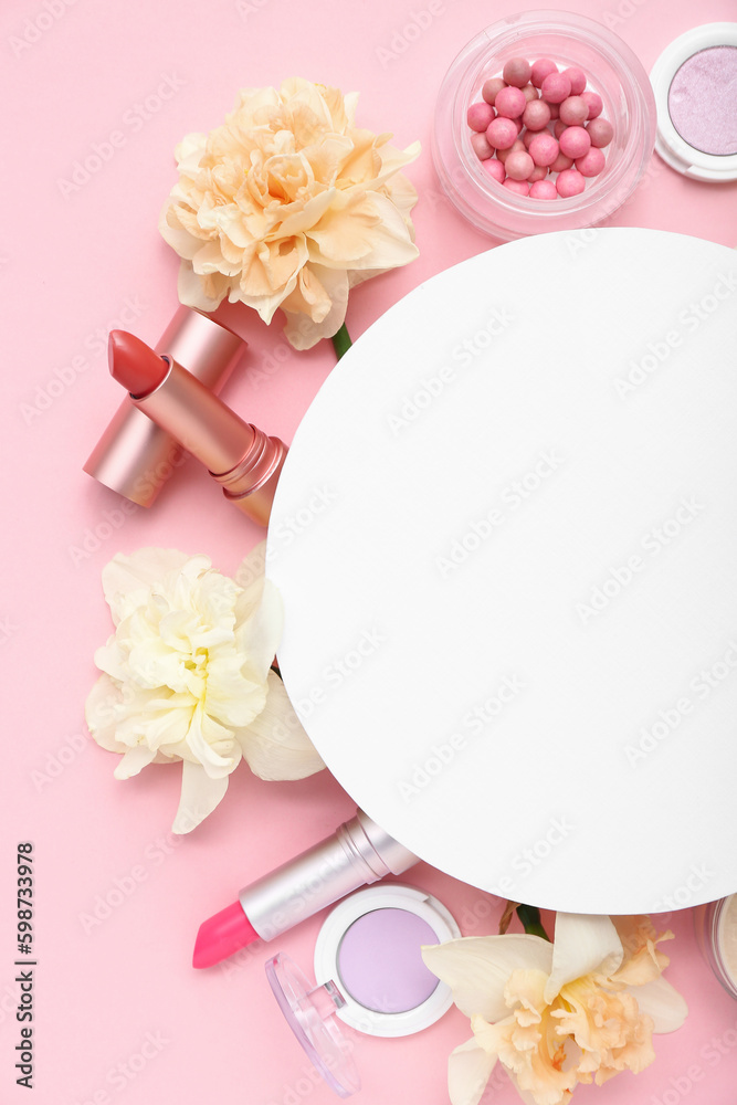 Blank card with frame made of different cosmetics and daffodils  on pink background