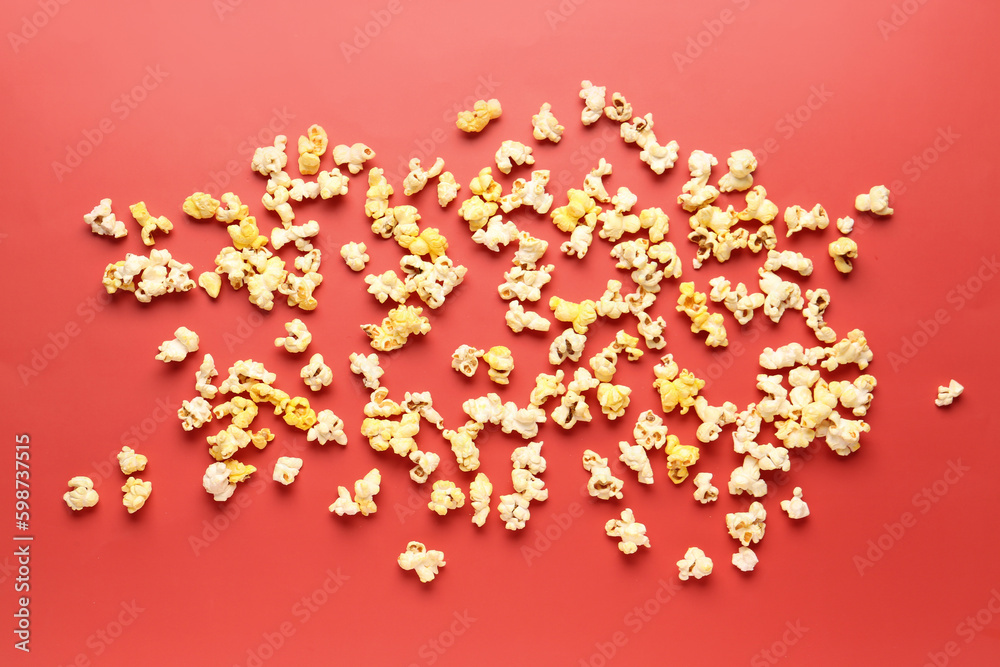 Crispy popcorn on red background