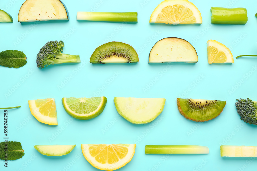 Composition with fresh fruits and vegetables on turquoise background