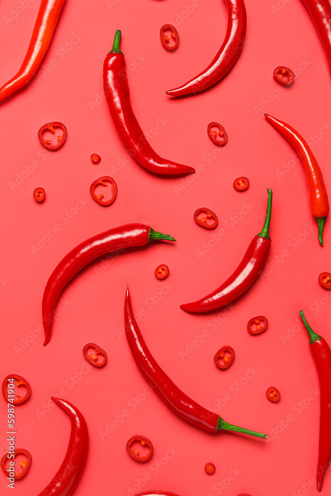 Fresh hot chili peppers on red background