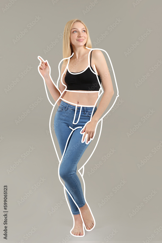 Beautiful young woman after weight loss on grey background