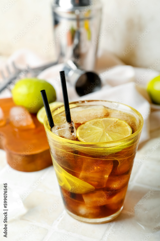 Glass of tasty Cuba Libre cocktail on table