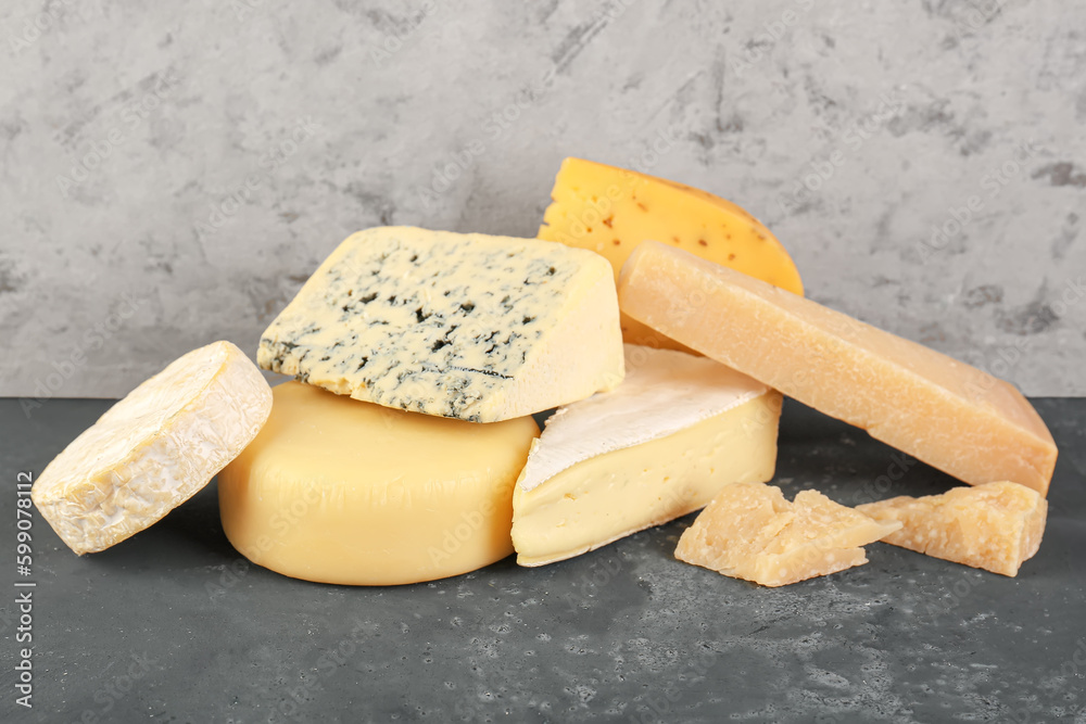 Different types of cheese on table