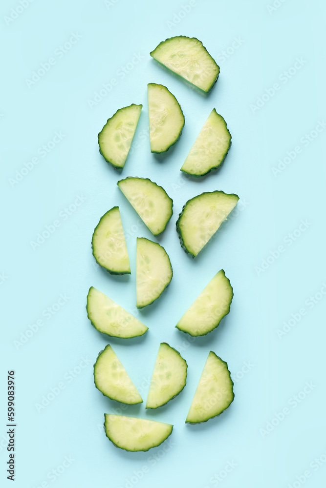 Slices of cucumber on turquoise background