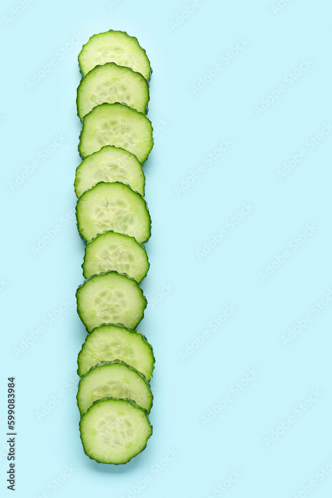 Slices of cucumber on turquoise background