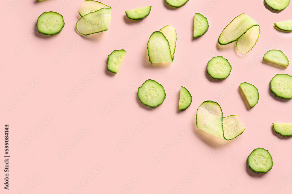 Slices of cucumber on pink background