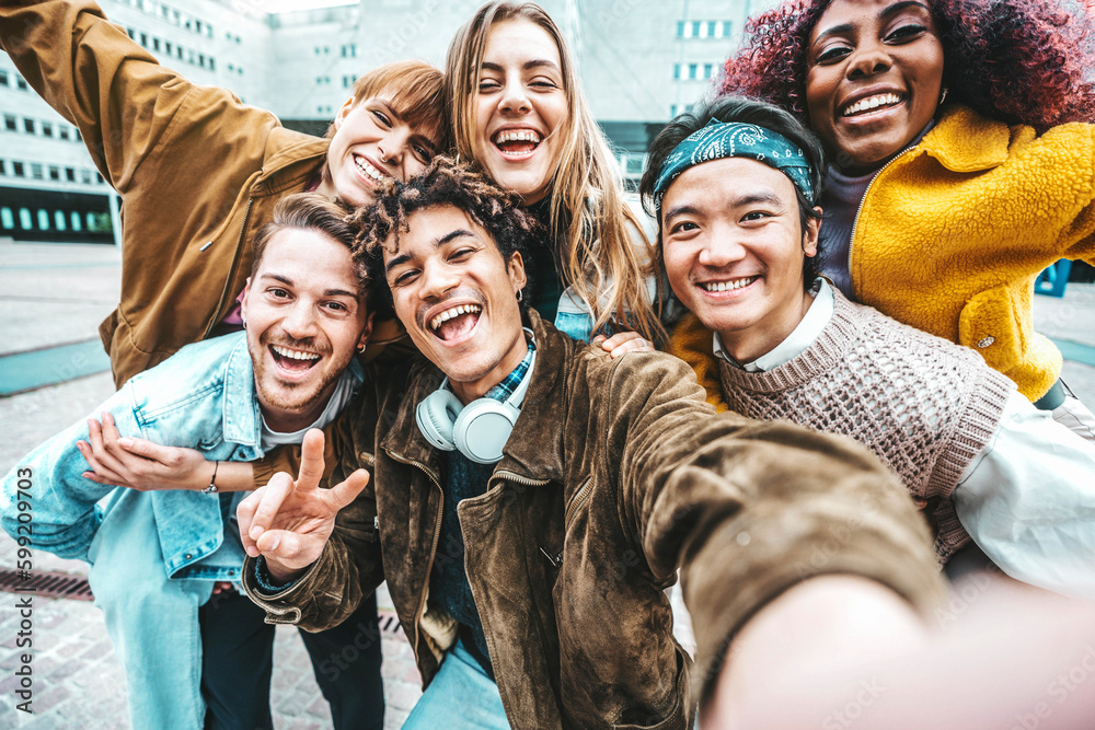 Multiracial friends taking selfie pic outdoors - Happy young people having fun walking on city stree