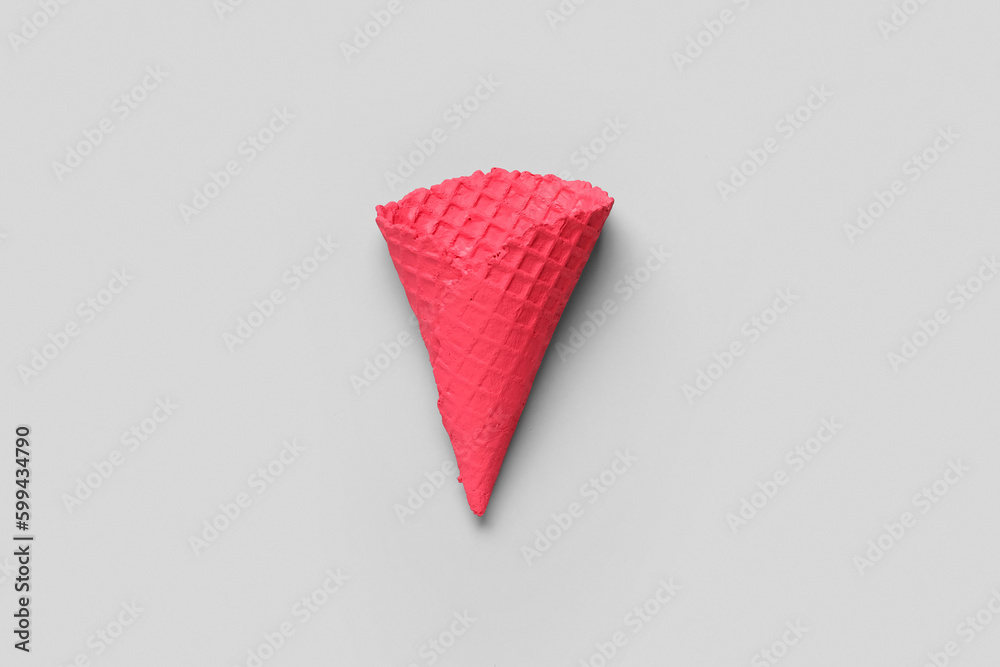 Painted waffle cone on light background