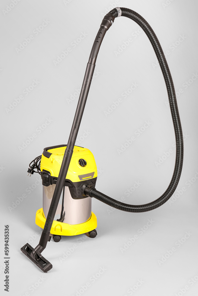 Vacuum cleaner on grey background