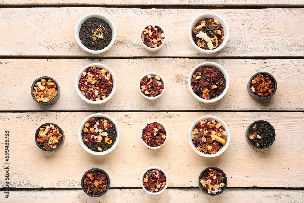 Assortment with different types of dried fruit tea on white wooden background