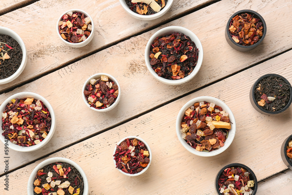 Assortment with different types of dried fruit tea on white wooden background