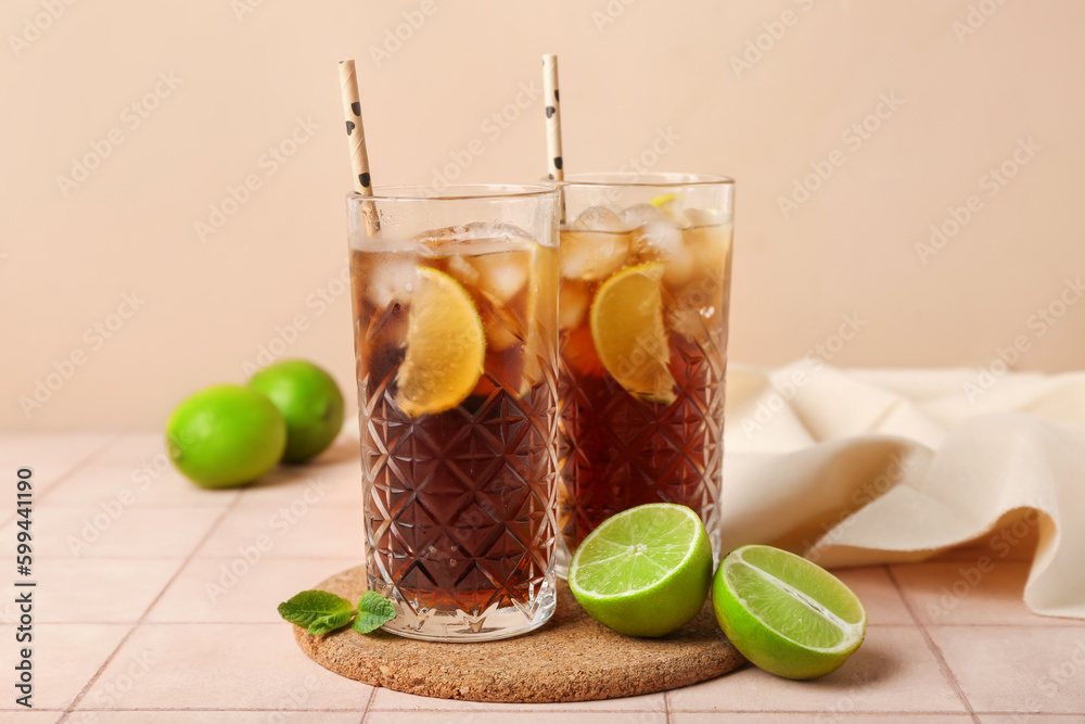 Glasses of cold Cuba Libre cocktail on table