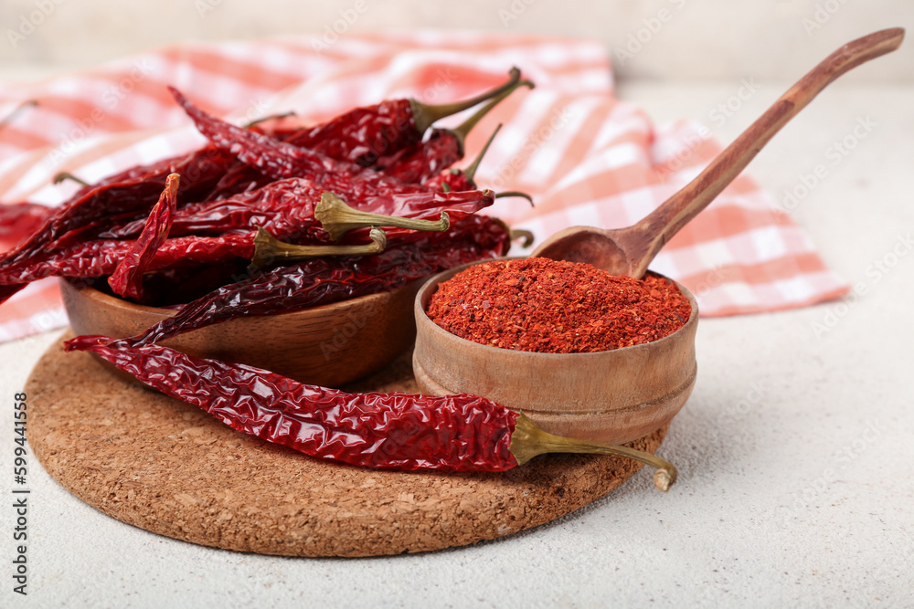 Composition with dry hot chili peppers and spices on white background