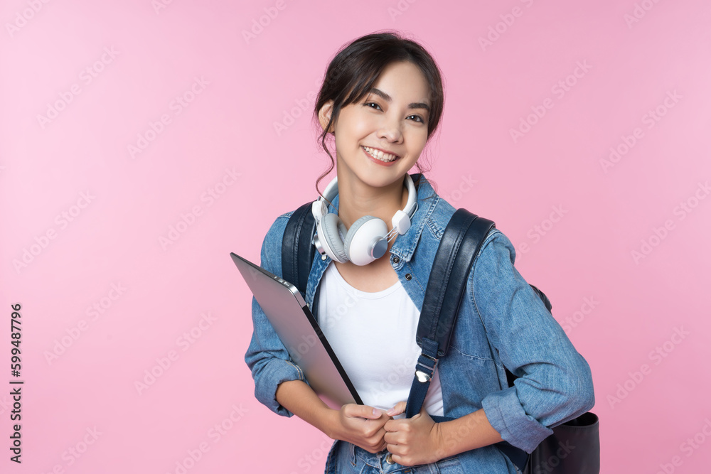 Portrait of young Asian woman student standing with smartphone coffee and backpack.College Teenager 