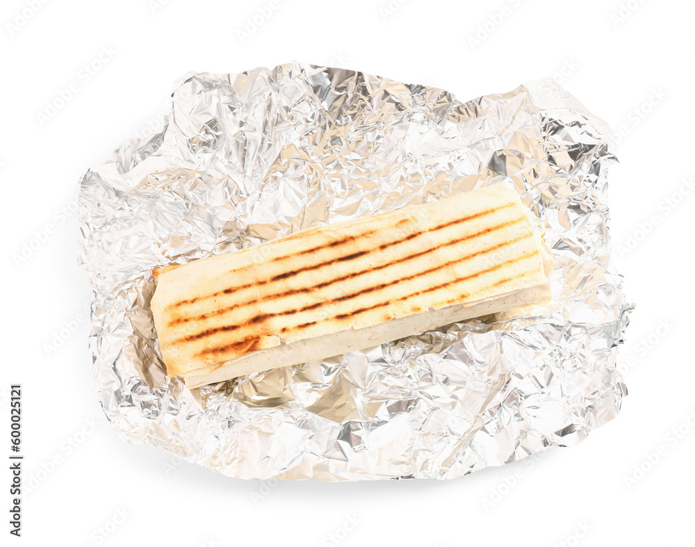 Tasty shawarma with foil on white background