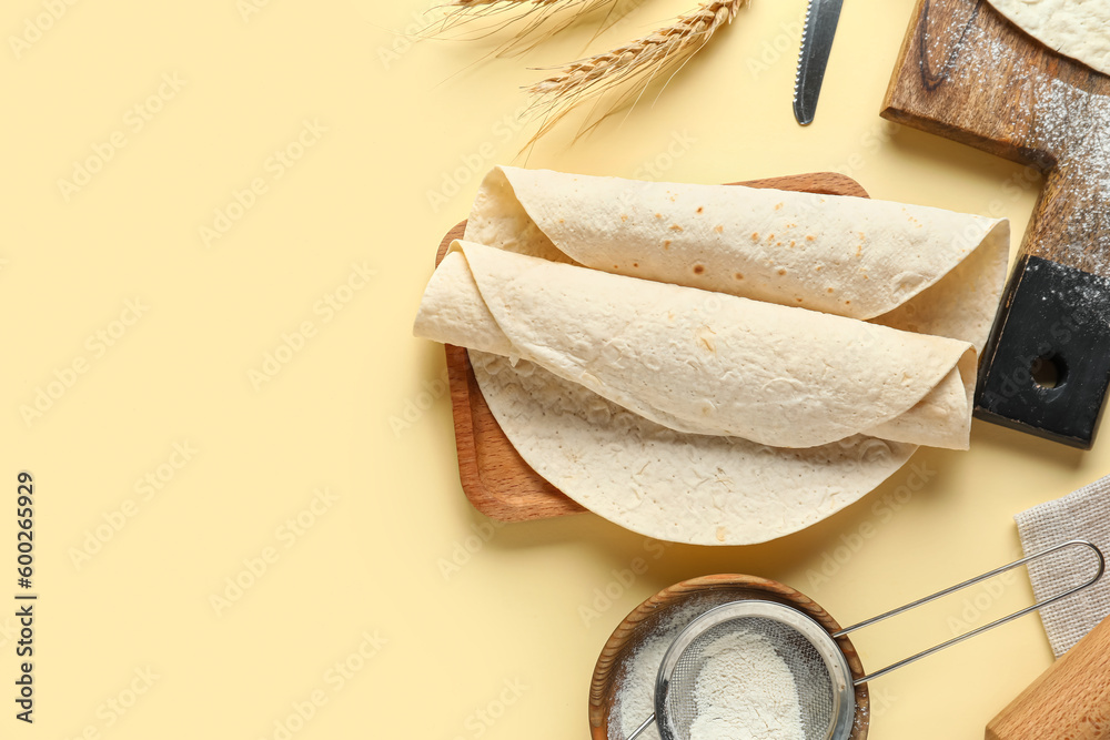 Boards with ingredients for preparing lavash on beige background