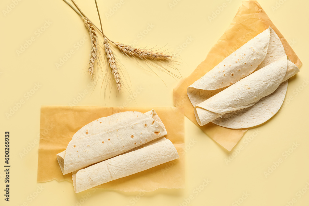 Baking paper with thin lavash on beige background