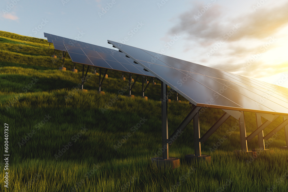 Rows of solar panels at sunset in a field against the backdrop of green grass. Ground power plant of