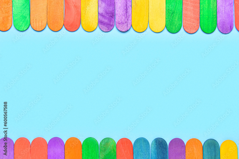 Colorful ice cream sticks on blue background