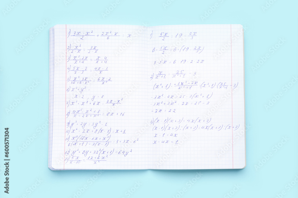 Copybook with maths formulas on blue background