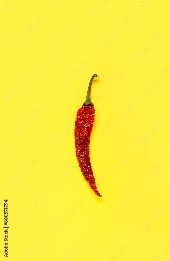 Dry hot chili pepper on yellow background