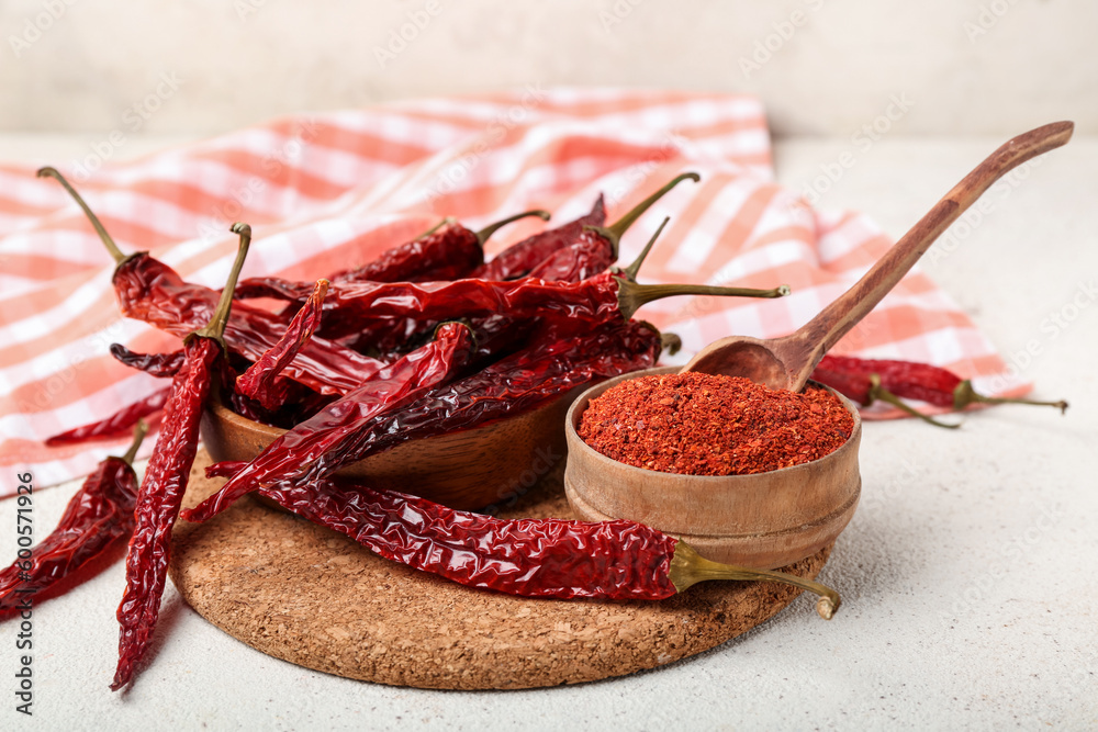 Composition with dry hot chili peppers and spices on white background