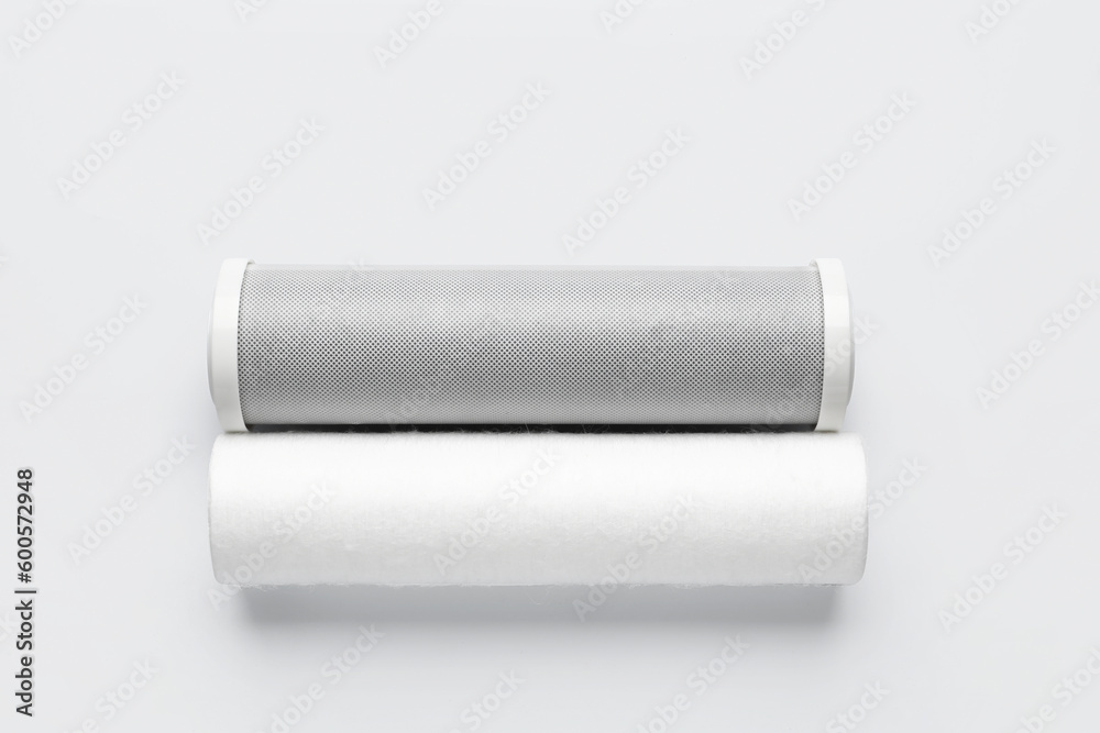 New water filter cartridges on grey background