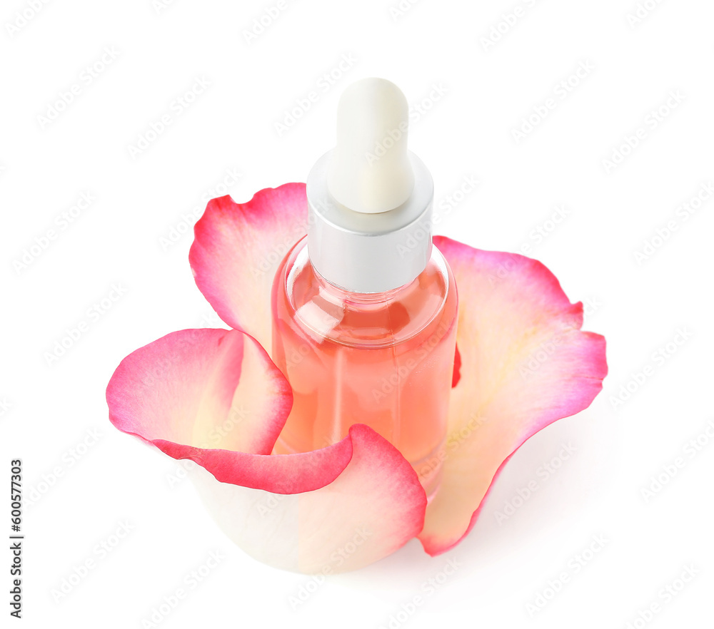 Bottle of cosmetic oil with rose extract and petals on white background