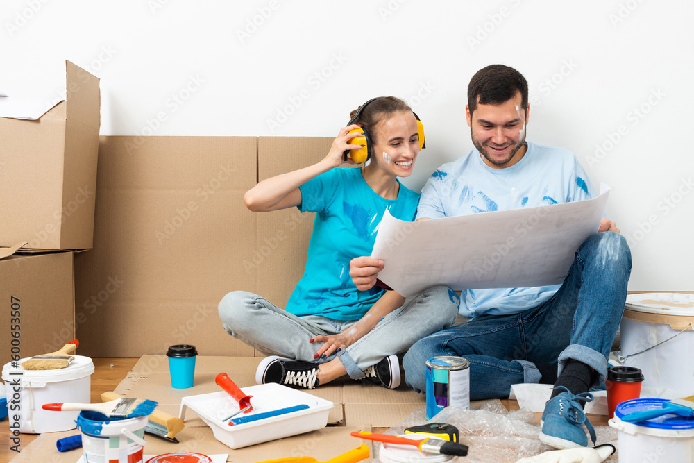 Happy boy and girl in protective headphones