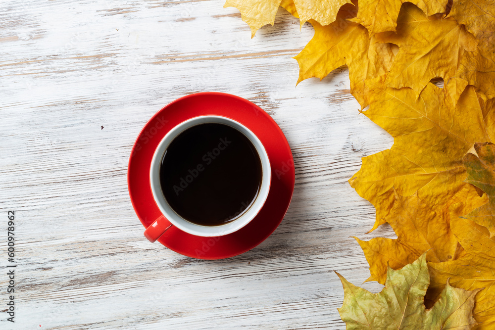 Flat lay autumn composition with cup of black tea