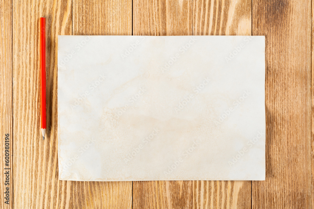 Sheet of paper lying on wooden table