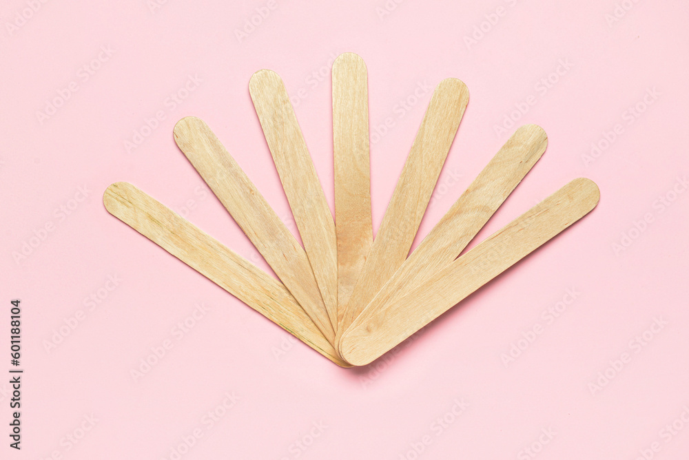 Ice cream sticks on pink background