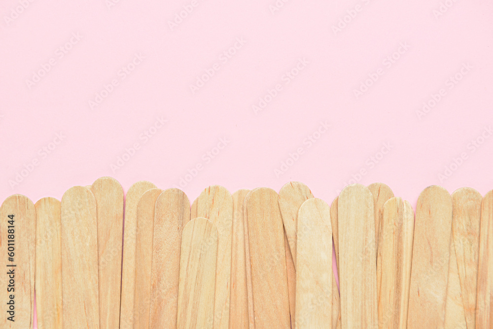 Ice cream sticks on pink background