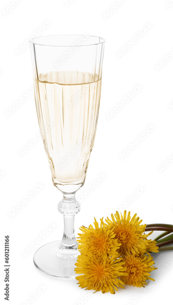 Glass of dandelion wine on white background