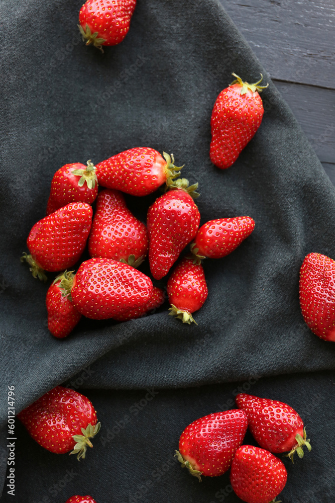 Fresh strawberries on black napkin