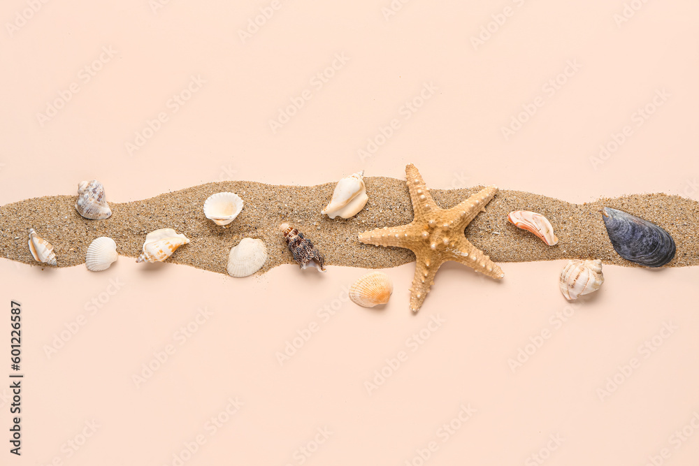 Sand with seashells and starfishes on pale pink background