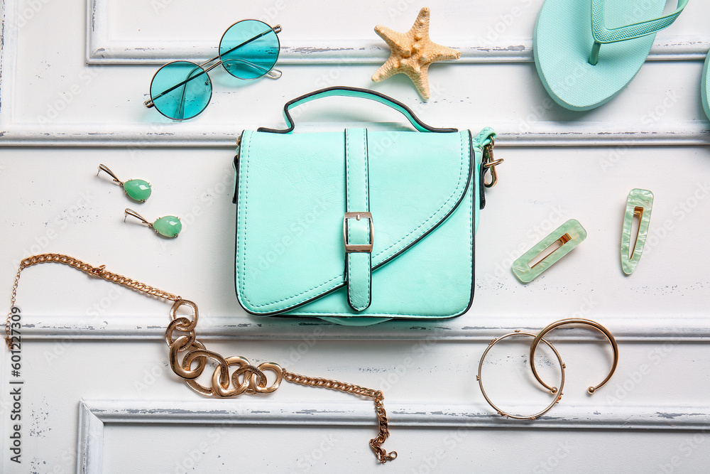 Stylish bag and different accessories on white background