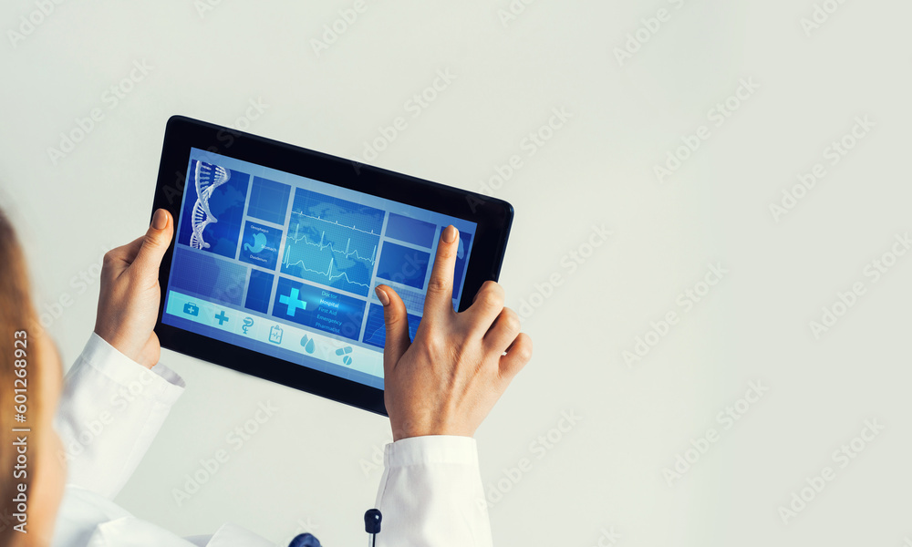 Close of female doctor hands working with tablet pc computer