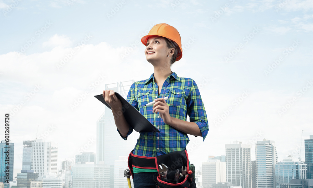 Young building inspector checking outdoor