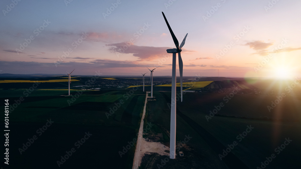 Windmill turbines generating green energy electric.Green energy helps reduce carbon emissions and ma