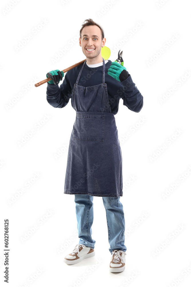 Male gardener with secateurs and shovel on white background