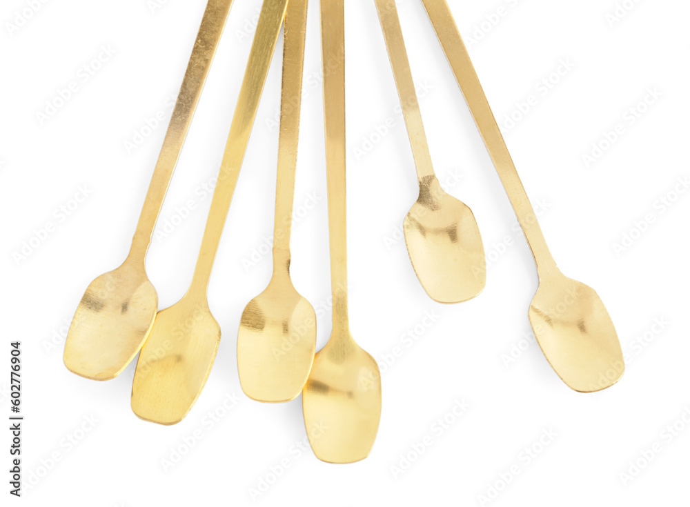 Golden spoons on white background