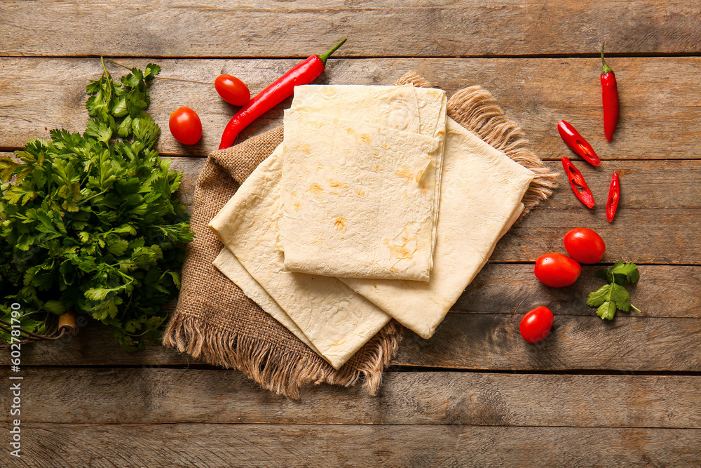 Fresh lavash on wooden background