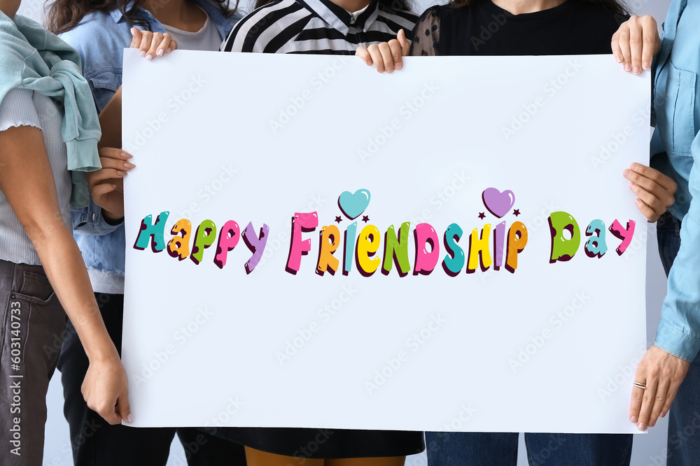 Many people holding placard for Friendship Day