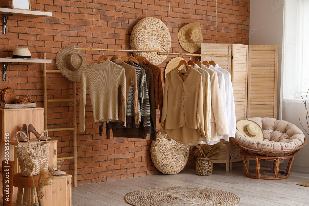 Interior of modern boutique with stylish female clothes and accessories