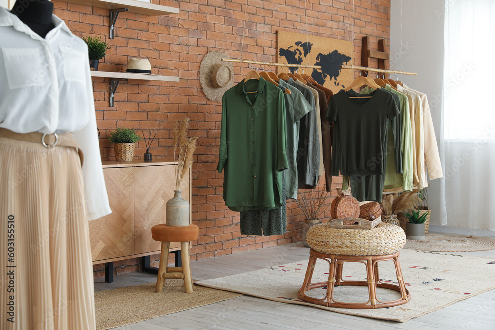 Interior of modern boutique with stylish female clothes and accessories