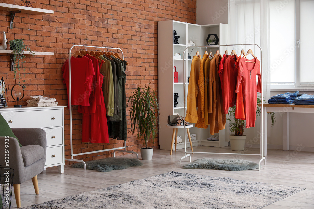 Interior of modern boutique with stylish female clothes and accessories