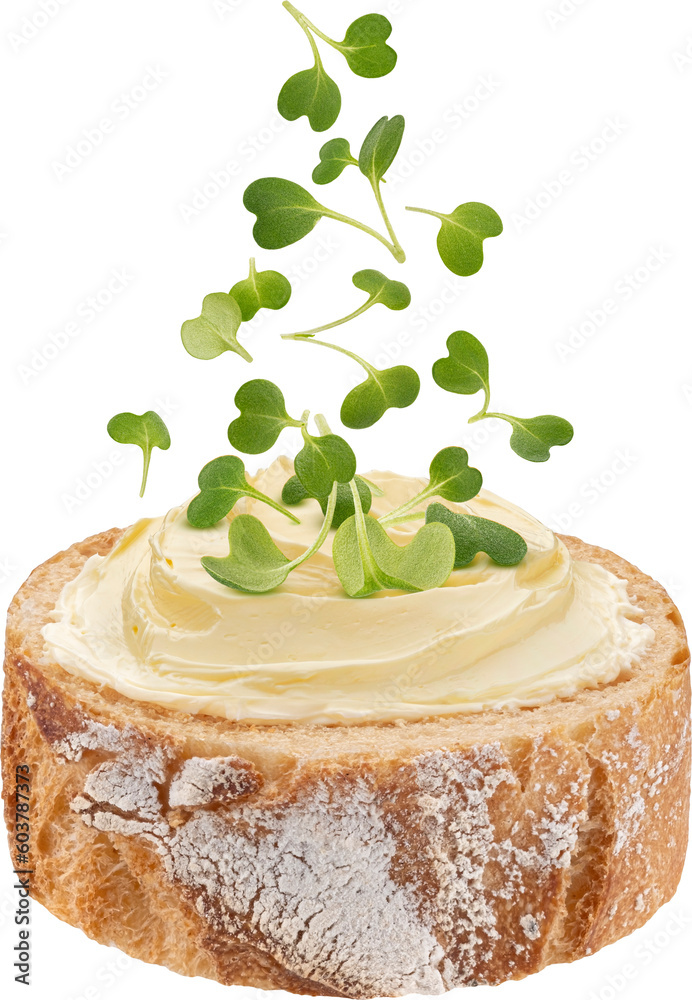 French baguette slice with butter and falling microgreen leaves isolated on white background, full d